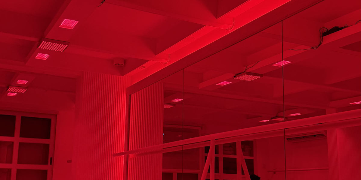 The Red Room: the studio lit red, with mirrors and a barre